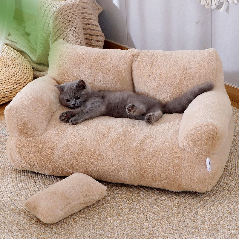 Cat lying on a beige pet bed with a soft texture